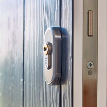 Load image into Gallery viewer, Oval Escutcheon shown on composite door with yale euro cylinder lock, all available from Anglian Home Improvements